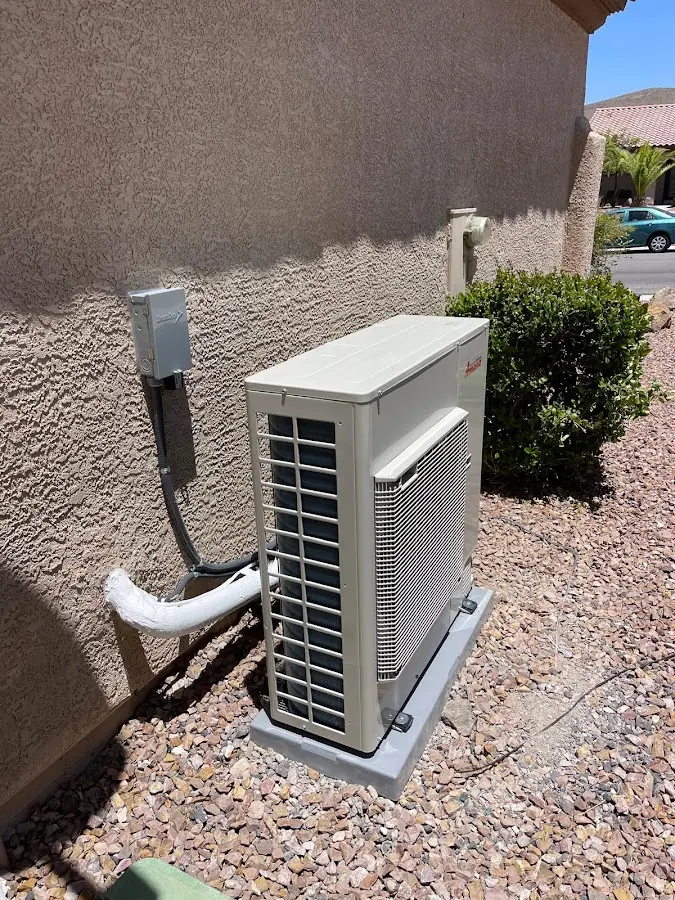 Residential air conditioning condenser unit in Granville